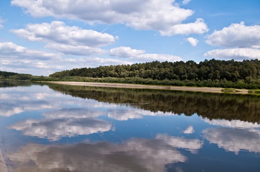 river with clouds reflected in the riverside