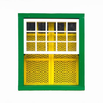 Decorative, colonial, green, vintage, window on a white wall in Paraty (or Parati), Brazil.
