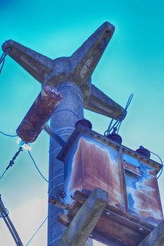 Top of electric pole under blue sky, hdr image