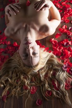 nude woman with rose petals