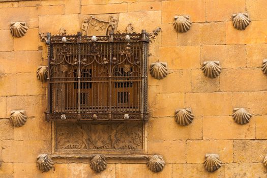 Detail of window with old forge in The House of Shells located in Salamanca Spain
