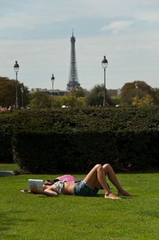 sexy girl on grass on Tuileries garden in Paris