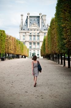 woman walking in tuileries garden in Paris