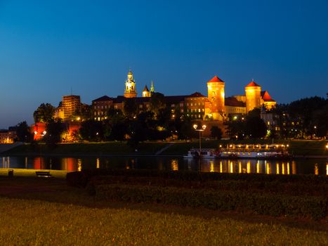 Wawel Castle and Vistula River in Krakow by night (Poland)