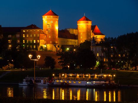 Wawel Castle and Vistula River in Krakow by night (Poland)