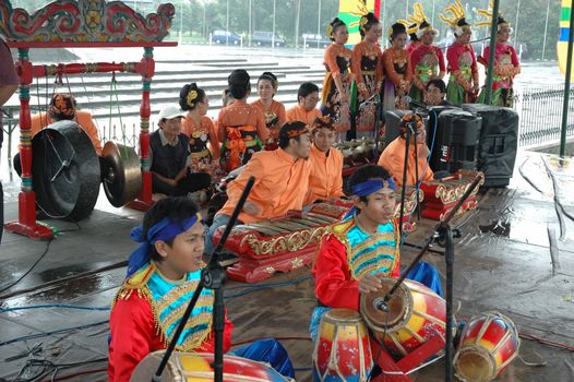 Bandung, Indonesia - March 9, 2008: Dancer member and musical crew gather together and make preparation before get performing on stage at Tegalega Park Bandung, West Java-Indonesia.