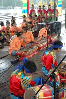 Bandung, Indonesia - March 9, 2008: Dancer member and musical crew gather together and make preparation before get performing on stage at Tegalega Park Bandung, West Java-Indonesia.