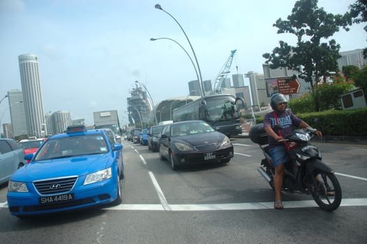 Singapore, Singapore - January 18, 2014: Road traffic at Singapore.