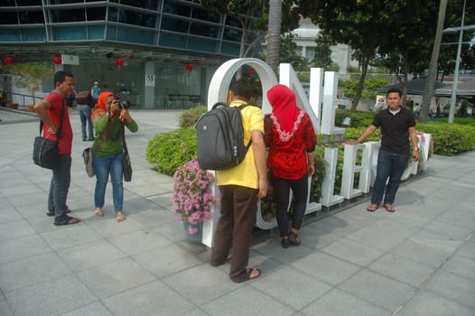 Singapore, Singapore - January 18, 2014: Group of tourist that visiting Merlion Park Singapore.