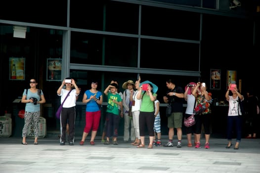 Singapore, Singapore - January 18, 2014: Group of tourist that visiting Merlion Park Singapore.