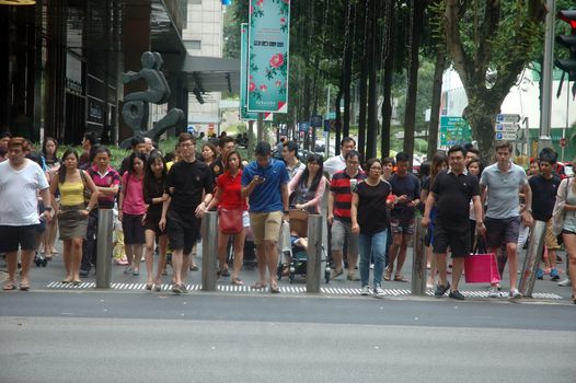 Singapore, Singapore - January 18, 2014: People crowd at Orchard road Singapore.