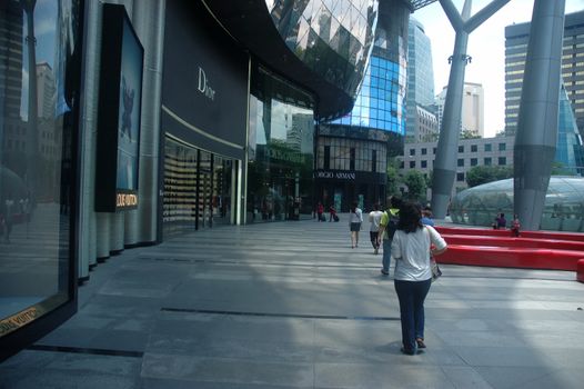 Orchard road, Singapore - April 14, 2013: Crowd shopping at Ion Orchard Mall in Singapore.