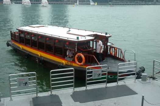 Singapore, Singapore - April 14, 2013: Tourist boat at Merlion Park harbour Singapore.