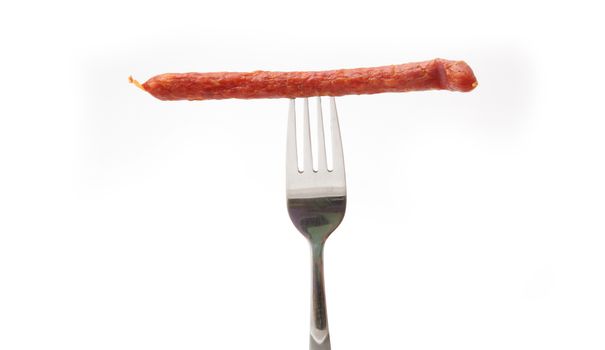 sausage on a fork isolated on white background