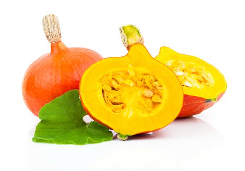 yellow pumpkins vegetables with green leaves isolated on white background