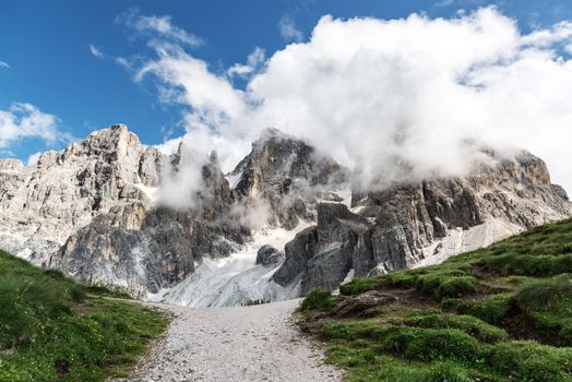 Dolomites, Pale di San Martino landscape in summer season with clouds - Italy