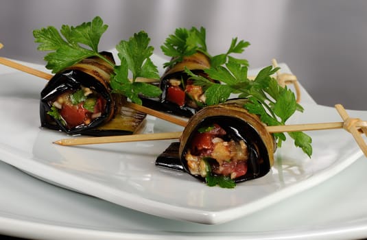 Rolls of fried eggplant stuffed with vegetables