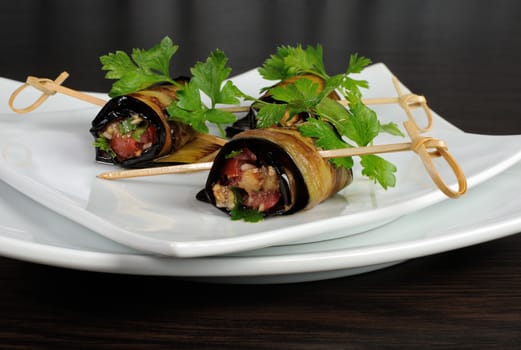 Rolls of fried eggplant stuffed with vegetables
