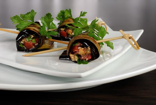 Rolls of fried eggplant stuffed with vegetables