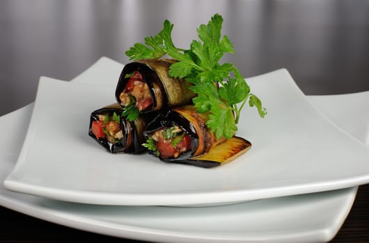 Rolls of fried eggplant stuffed with vegetables