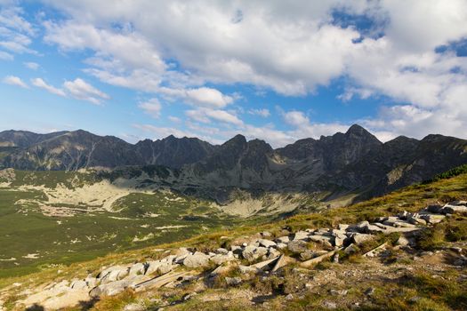 view on mountais in summer and blue sky with clouds