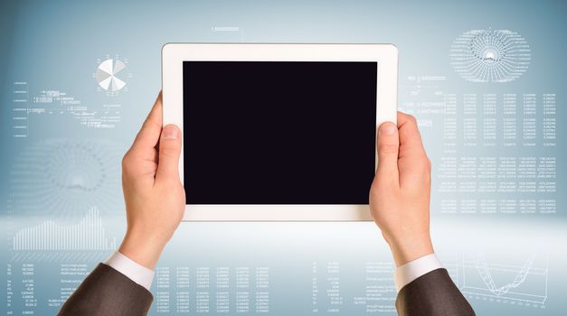Two hands hold tablet pc. Hi-tech background with graphs and figures