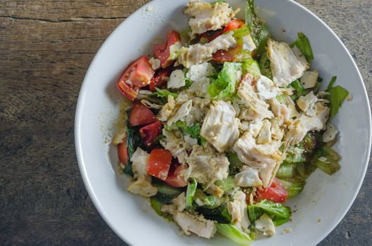 Chicken salad with tomatoes ,  bread and mix vegetables