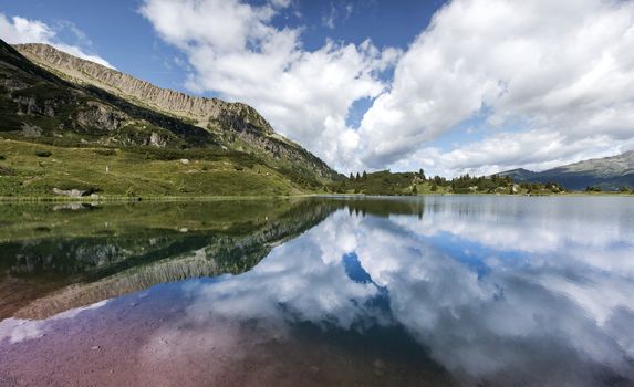 Landscape reflected in Lake Colbricon, Dolomites - Trentino