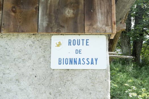 BIONNASSAY, FRANCE - AUGUST 24: Route de Bionnassay sign, one of the tour du Mont Blanc routes. The  popular European tour goes through France, Italy and Switzerland. August 24, 2014 in Bionnassay.