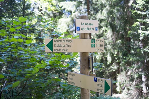 LE CHOSAL, FRANCE - AUGUST 24: Tour du Mont Blanc direction signs. The popular tour goes through France, Italy and Switzerland, and is clearly signalised throughout. August 24, 2014 in Le Chosal.