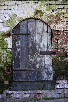 Old wall with wooden door at Alcatraz Island Jail off San Francisco's Coast in California