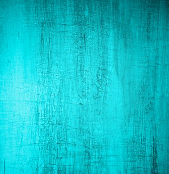 Turquoise Damaged Obsolete Cement Wall Background closeup