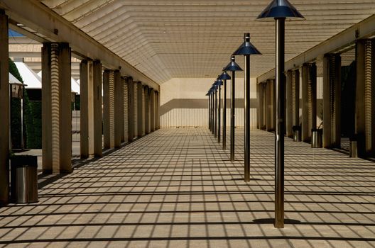 Recreation Terrace with Shadows on Ceiling Blinds and Street Lamps In a Row