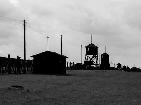 Tower silhouettes of concentration camp in Majdanek (Poland). In black and white.