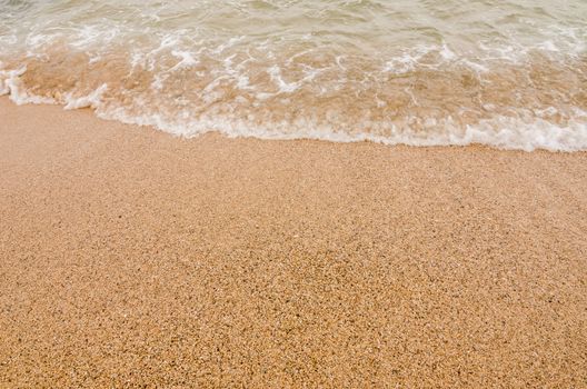 Wave of the sea on  sand beach in Thailand