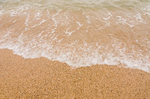 Wave of the sea on  sand beach in Thailand