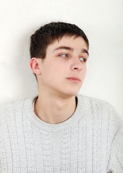 Teenager thinking near the wall at the Home