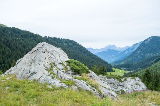 Bolder with La Rollaz valley in the background, one of the stages in the Mont Blanc Tour.