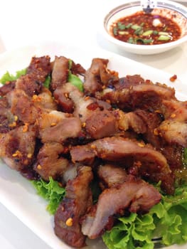 closed up spicy grilled pork , thai food