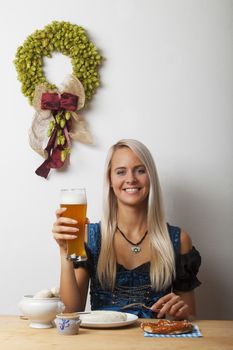 dirndl girl and a bavarian sausages