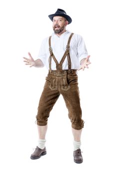A traditional bavarian man isolated on a white background presenting something