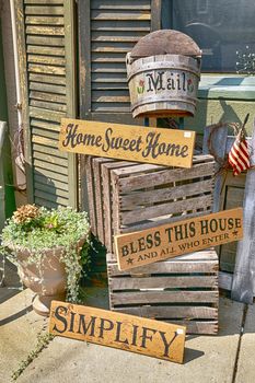 Crafty porch decorative signs in a well thought out display. Home sweet home. Bless this house. 