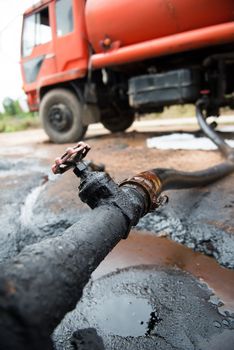 red truck transfer crude oil from the tank