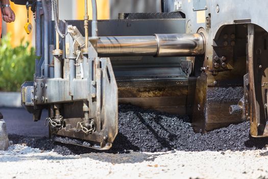 Heavy machiners construction works during asphalting road.
