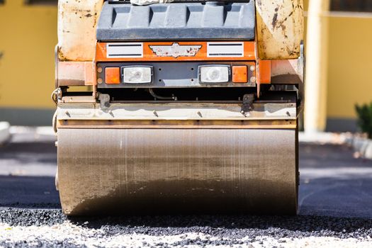 Heavy machiners construction works during asphalting road.