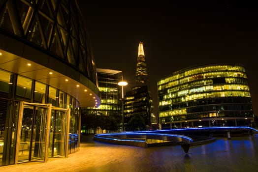 Night view on London bussines skycrapers on Thames bank in Southwark