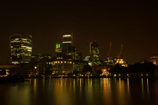 Night view on London bussines skycrapers on Thames bank in Southwark