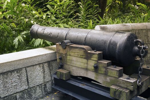 historical 9-pounds cannon placed on the hill of famous Fort Canning Park in Singapore