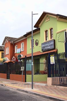 QUITO, ECUADOR - AUGUST 6, 2014: Hostel Discovery Quito and El Changarro Bar on Mariscal Foch Street in the tourist district on August 6, 2014 in Quito, Ecuador. Around the streets Foch and Reina Victoria are man bars, restaurants and hostels-hotels.