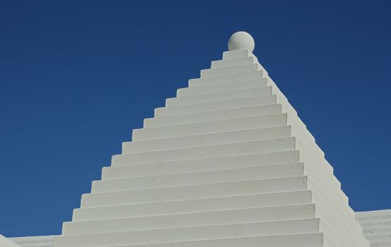 A typical White Bermuda Buttery Roof, against a deep blue sky